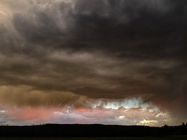 [© Yellowstone Sky by Amory B. Lovins is described with Color, Fine Art, 5/19 for web, crimson, orange, gray, black, storm, Yellowstone Park, Horizontal, retro hit 19985 rate ]